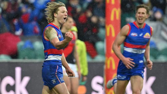 Cody Weightman of the Bulldogs celebrates kicking a goal.