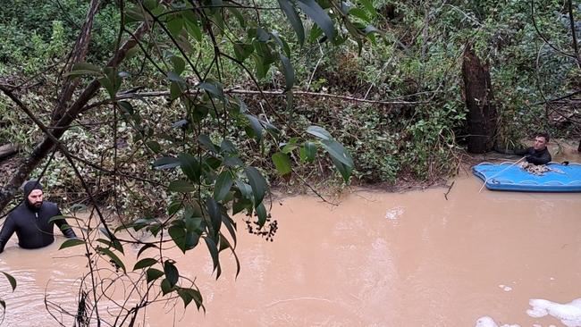 Emergency services divers in flood waters at Nanango on Friday. The body of a man, belived to be a 47-year-old from Nanango, was discovered.