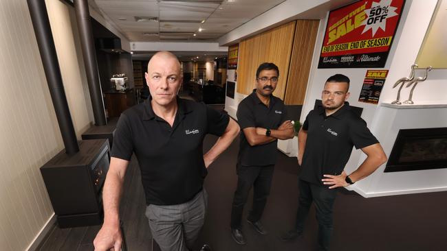 Illusion Gas Log fires General Manager Nicholas Smith in the company’s Dandenong showroom with staff George Paraskeva and Ash Varkey. Picture: Alex Coppel.