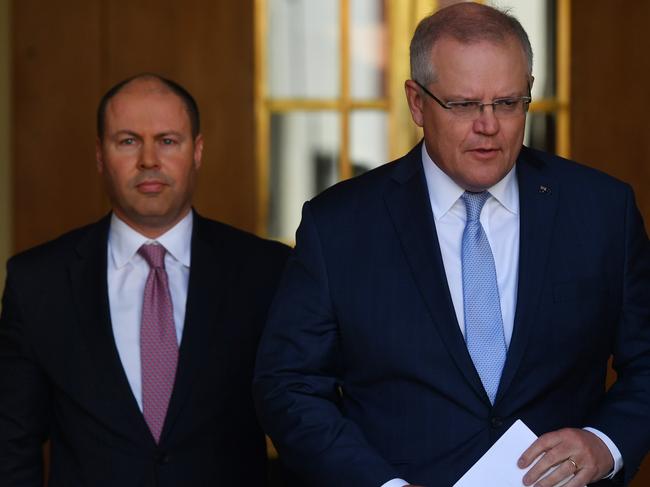 Treasurer Josh Frydenberg and Prime Minister Scott Morrison arrive for today’s press conference. Picture: Getty Images