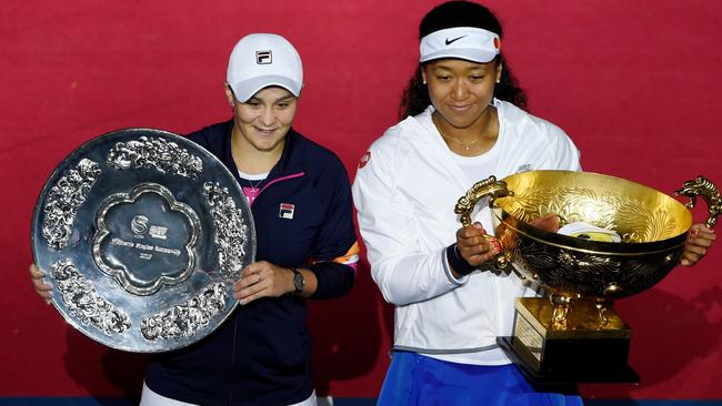 Osaka and Barty with their trophies. Picture: AFP