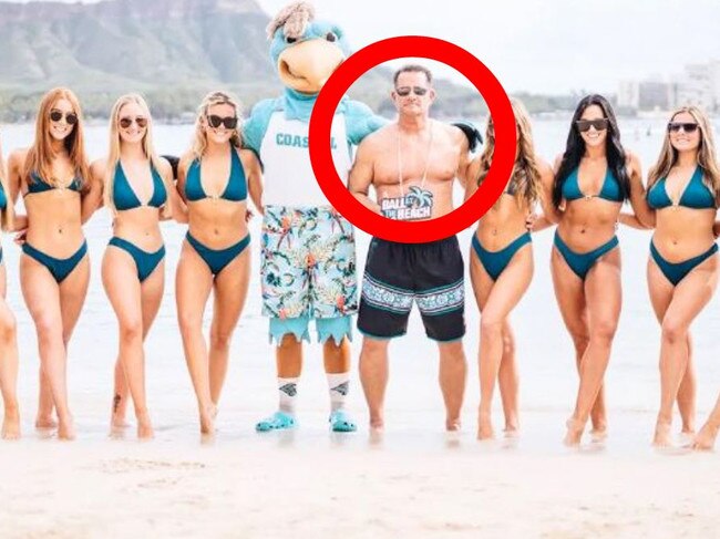 Coastal Carolina University football coach Tim Beck has addressed a since-deleted photo that showed him posing shirtless alongside the school’s bikini-clad dance team while on the beach in Hawaii for the EasyPost Hawai’i Bowl this week.