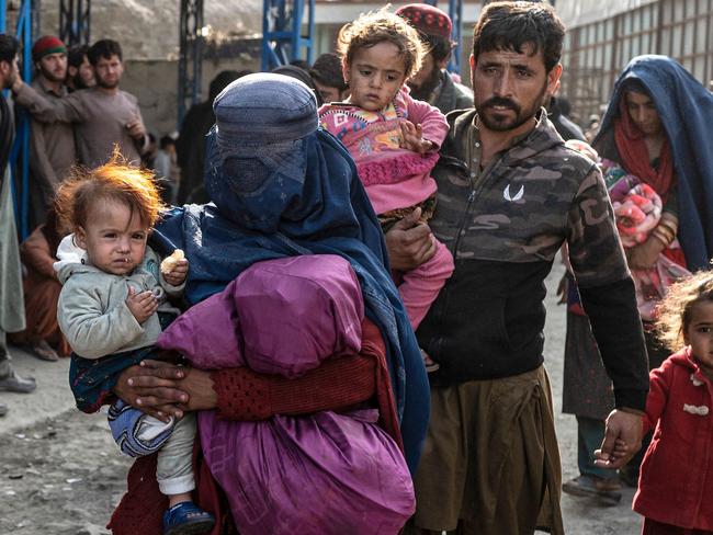 Afghan refugees arrive from Pakistan at the Afghanistan-Pakistan Torkham border in Nangarhar province on November 2, 2023. More than 165,000 Afghans have fled Pakistan in the month since its government ordered 1.7 million people to leave or face arrest and deportation, officials said on November 2. (Photo by Wakil KOHSAR / AFP)