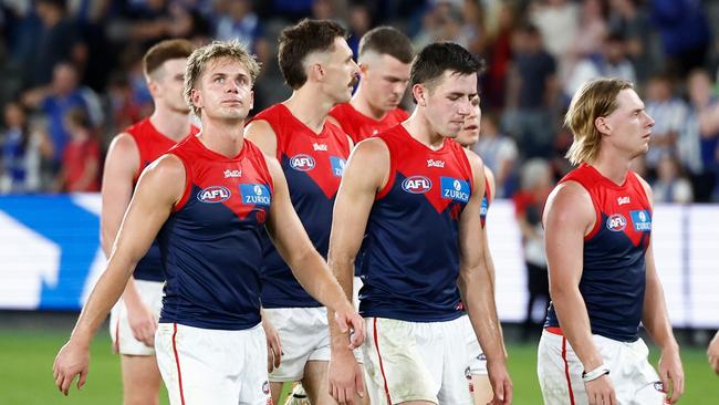 MELBOURNE, AUSTRALIA – MARCH 23: Demons players look dejected after a loss during the 2025 AFL Round 02 match between the North Melbourne Kangaroos and the Melbourne Demons at Marvel Stadium on March 23, 2025 in Melbourne, Australia. (Photo by Michael Willson/AFL Photos via Getty Images)