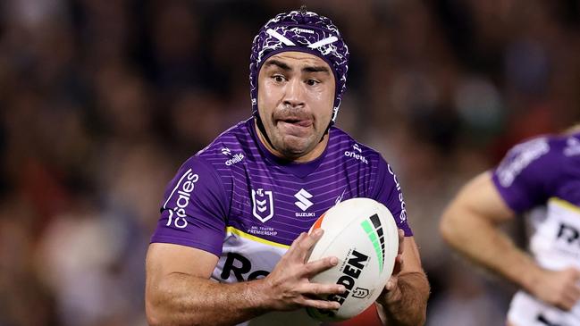 PENRITH, AUSTRALIA - AUGUST 15: Jahrome Hughes of the Storm runs the ball during the round 24 NRL match between Penrith Panthers and Melbourne Storm at BlueBet Stadium, on August 15, 2024, in Penrith, Australia. (Photo by Brendon Thorne/Getty Images)