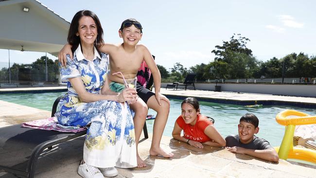 Pictured with her kids, Anastasia Massouras who recently purchased an apartment on the beach, where she plans to spend time holidaying. Picture: Richard Dobson