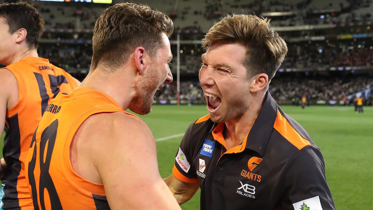Toby Greene celebrates with Daniel Lloyd after the GWS Giants defeated Collingwood. Photo: Phil Hillyard