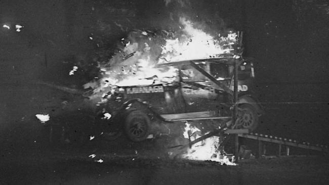 Reg Kavanagh creates a stunt car crash at Sydney Showground Speedway in 1938. Picture: State Library of NSW