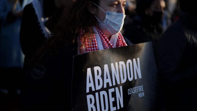 A woman holds a sign at the protest. Picture: AFP