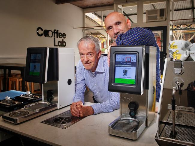 Bill Purton (left) and Mario Colaiacovo (right) from Caffe Assist with their revolutionary machine that automatically steams and textures milk Picture: Luis Enrique Ascui