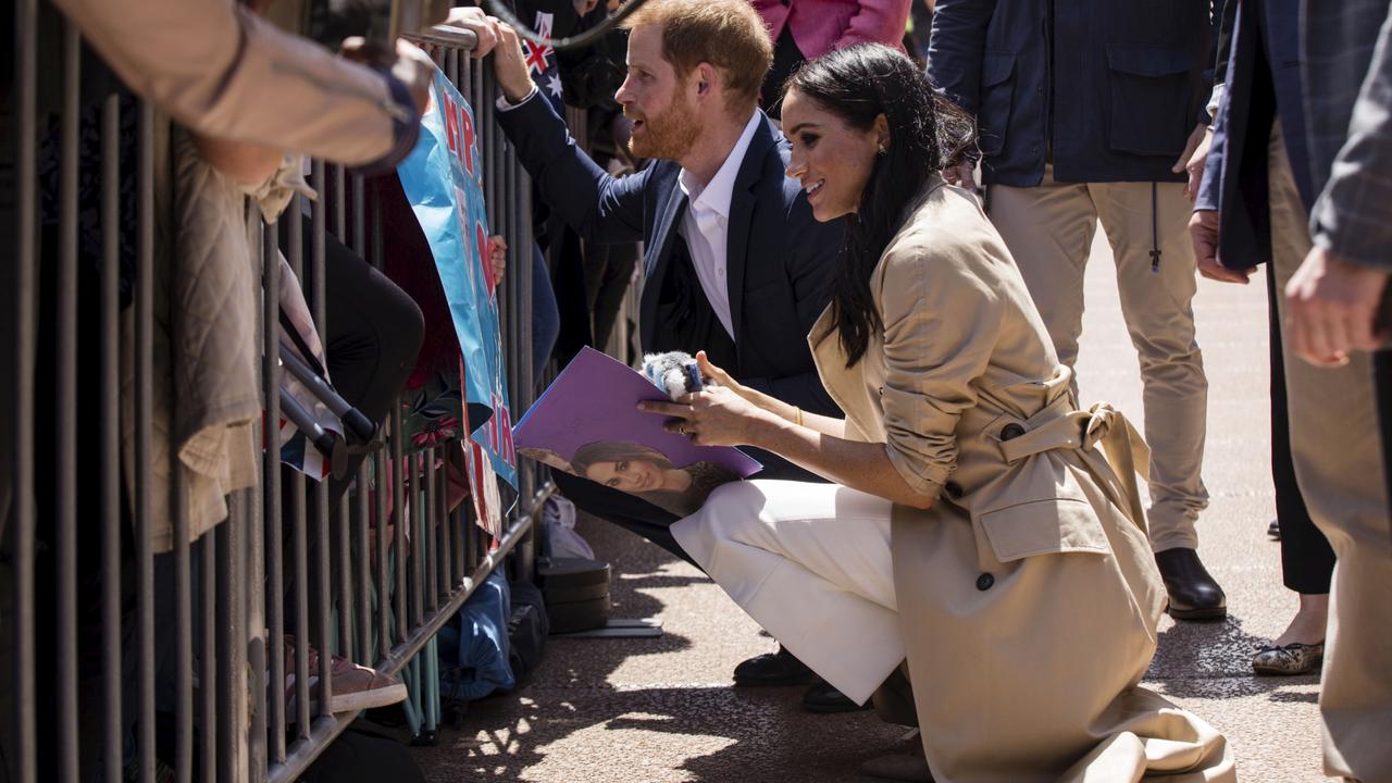 POOL. The Duke and Duchess Harry and Meghan meet the crowd outside the Opera House in Sydney on October 16, 2018. Photo: Pool Photo/ Dominic Lorrimer/ Fairfax Media