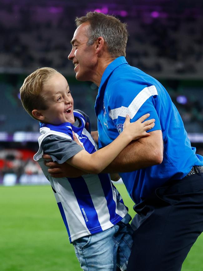 Alastair Clarkson, Senior Coach of the Kangaroos and RCH patient Ollie embrace. Picture: Michael Willson/AFL Photos via Getty Images