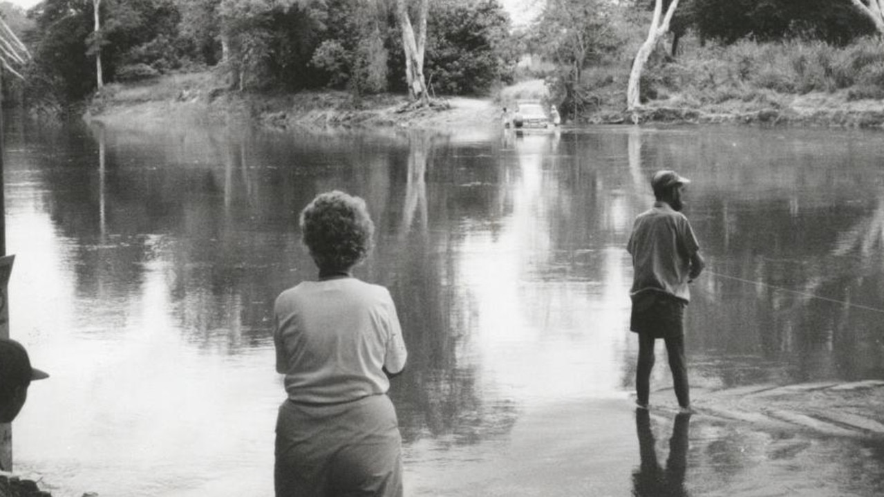 A photograph taken moments before a fisherman was grabbed by a crocodile and killed.