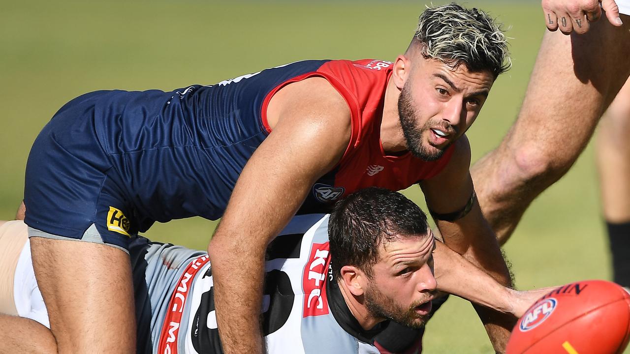 ALICE SPRINGS, AUSTRALIA - JULY 17: Christian Salem of the Demons and Travis Boak of the Power in action during the 2022 AFL Round 18 match between the Melbourne Demons and the Port Adelaide Power at TIO Traeger Park on July 17, 2022 in Alice Springs, Australia. (Photo by Felicity Elliott/AFL Photos via Getty Images)