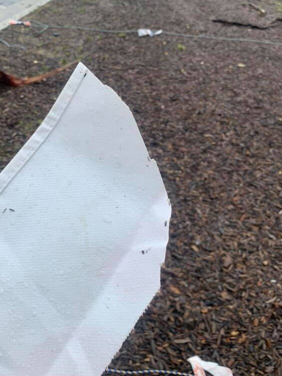 A section torn off a vandalised marquee at the COVID-19 testing station in the car park at Rat Park, in North Narrabeen Reserve at Warriewood. Picture: SES