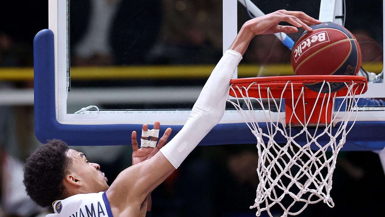 He makes dunking look comical. (Photo by FRANCK FIFE / AFP)