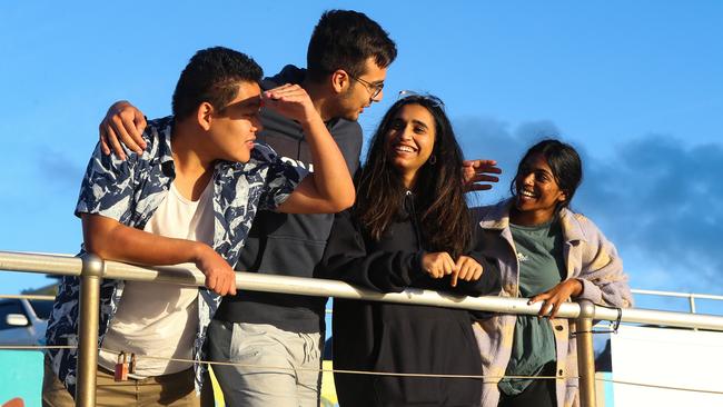 A group of friends enjoy the first sunrise of 2020 at Bondi Beach. Picture: Newscorp Daily Telegraph / Gaye Gerard