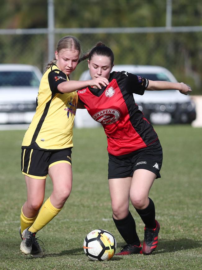 Tigers' Molly Waddingham and Lions' Kayla Gulliver battle it out in the FNQ Premier League women's match between the Edge Hill Tigers and the Leichhardt Lions, held at Johnson Road, White Rock . PICTURE: BRENDAN RADKE