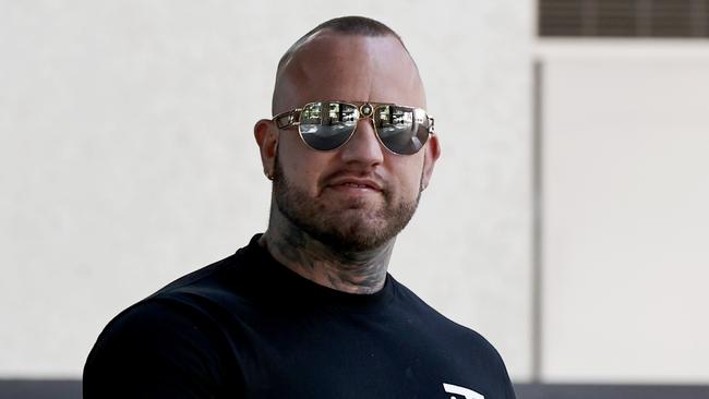 Bikie Matthew Kevin Mackay leaving Brisbane Magistrates Court.