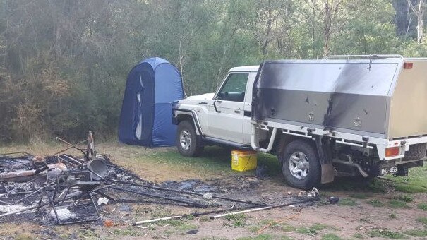 Russell Hill and Carol Clay’s burnt-out campsite near Dry River track at Billabong in the Wonnangatta Valley. Picture: ABC