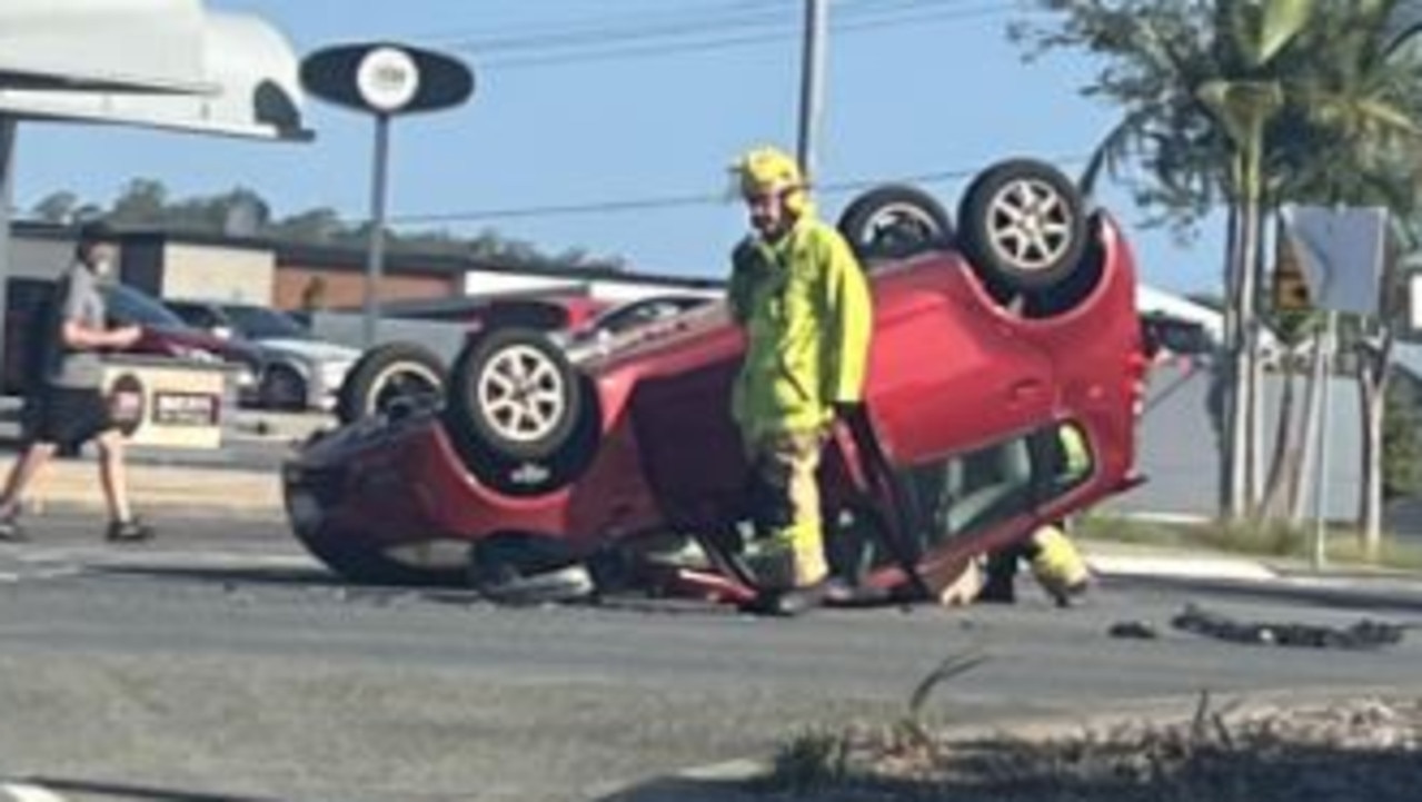 Young man rushed to hospital after car flips on busy road