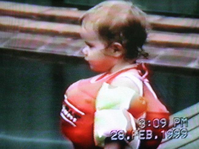 Laura Folbigg aged 19 months playing in the backyard pool at Singleton on the day before she died.