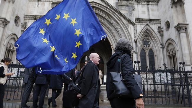 A Pro-EU protest group outside the court. The case is being brought by a group of UK residents including a finance worker and a hairdresser. Picture: AP/ Photo/Frank Augstein.