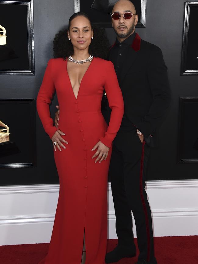 Alicia Keys, left, and Swizz Beatz arrive at the 61st annual Grammy Awards, which she is hosting. Picture: Getty