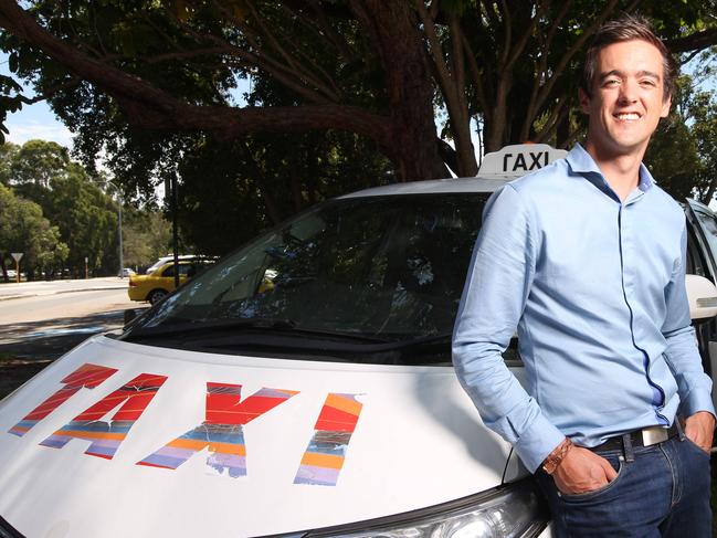 Co-Founder & CEO of goCatch, Ned Moorfield standing along side a cab with driver Allan Pierotti in Nedlands, Perth.