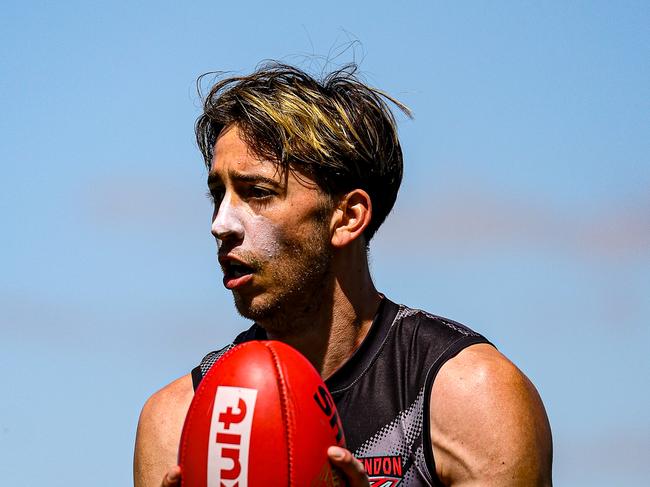 Nic Martin moves with the ball at Essendon training. Picture: Essendon FC