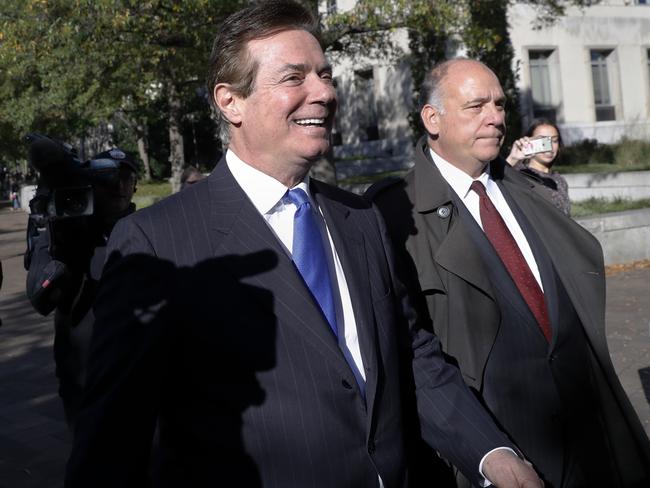 Paul Manafort (left) leaves Federal District Court in Washington on Monday after pleading not guilty to charges of conspiracy against the United States and other counts. Picture: Alex Brandon/AP