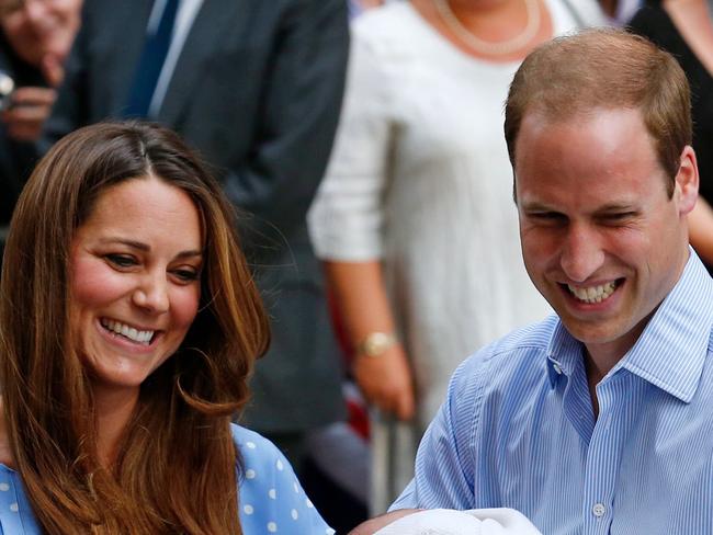 TO GO WITH AFP STORY BY KATHERINE HADDON (FILES) In a file picture taken on July 23, 2013 Britain's Prince William and Catherine, Duchess of Cambridge show their new-born baby boy, Prince George of Cambridge, to the world's media outside the Lindo Wing of St Mary's Hospital in London. When Prince William and his wife Kate emerge from hospital cradling Britain's new royal baby, expect April 2015, for the cameras, the picture will be on the front of newspapers worldwide. But don't expect many photographs after that. The second in line to the throne and his wife have fought hard for the right to bring up their family in private, despite being one of the most famous couples in the world. AFP PHOTO / ANDREW COWIE