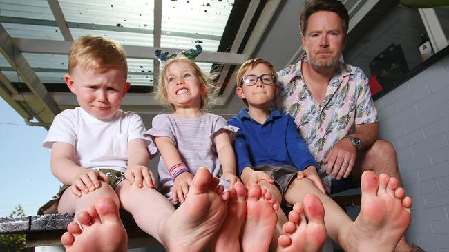 Tom Higgs with his nephew, Anderson, and two children, Luisa and Martin, and their sore feet after playing in the Norlane ARC pool. Picture: Alan Barber