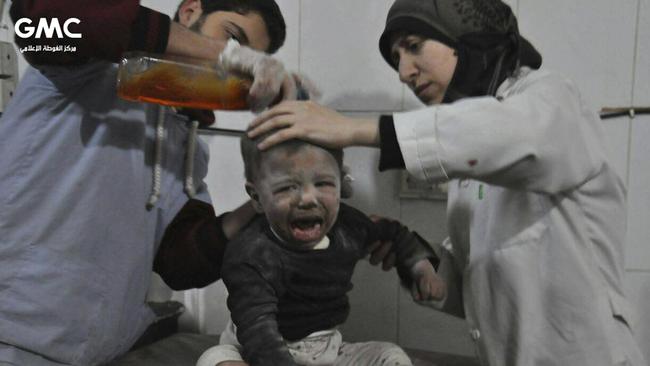 Medics treat a child who was wounded during air strikes and shelling by Syrian government forces, at a makeshift hospital in Ghouta. Picture: Ghouta Media Center/AP