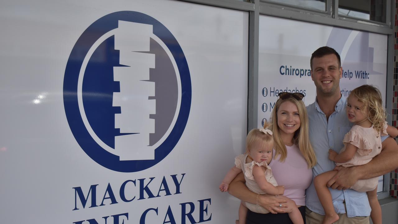 Dr George Hannaford with his wife Amanda and two daughters Matilda (2) and Eloise (11 months) at the new office for Spinal care along Shakespeare street