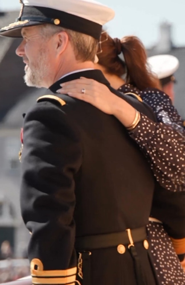 Frederik and Mary put their arms around each other on board the Royal Yacht Dannebrog.