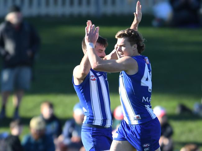 HOBART, AUSTRALIA - JUNE 26: Cameron Zurhaar of the Kangaroos celebrates a goal during the round 15 AFL match between the North Melbourne Kangaroos and the Gold Coast Suns at Blundstone Arena on June 26, 2021 in Hobart, Australia. (Photo by Steve Bell/Getty Images)