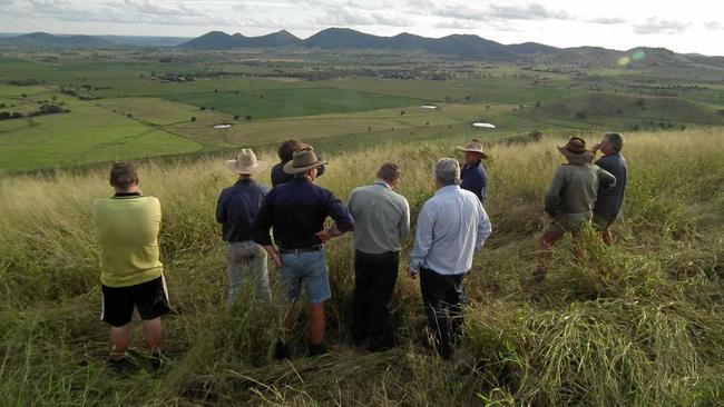 JUST ADD WATER: Coalstoun Lakes farmers with Member for Flynn Ken O'Dowd look down on the valley that would benefit from a regular supply of water. Picture: Erica Murree