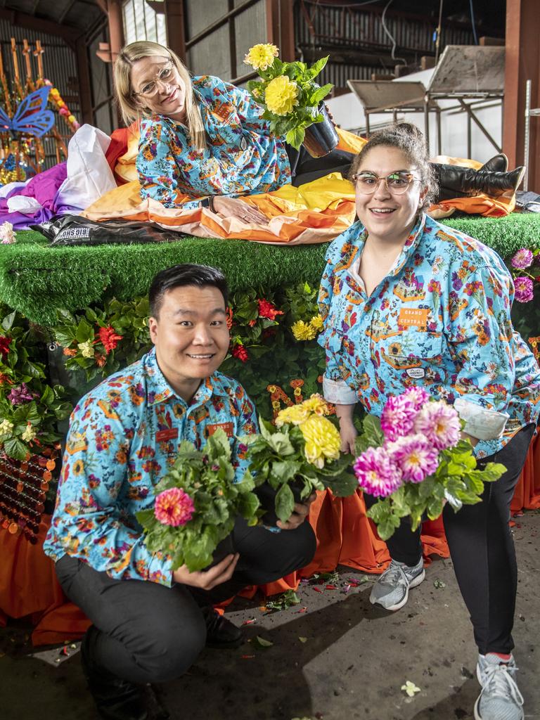 The Grand Central team (from left) John Zhang, Julie Thompson and Georgina Bayly work on their float for the Grand Central Floral Parade. Picture: Nev Madsen.