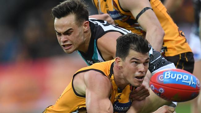 Karl Amon puts some heat on Hawthorn star Jaeger O'Meara. Picture: AAP Image/Julian Smith