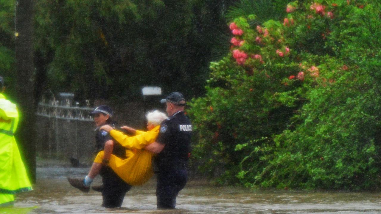 Police rescue an elderly man from his Railway Estate home. Picture: Zak Simmonds