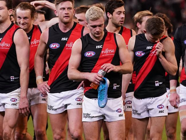 The Bombers leave the field after losing the Round 23 AFL match between the Collingwood Magpies and the Essendon Bombers at the MCG in Melbourne, Friday, August 23, 2019.  (AAP Image/Scott Barbour) NO ARCHIVING, EDITORIAL USE ONLY