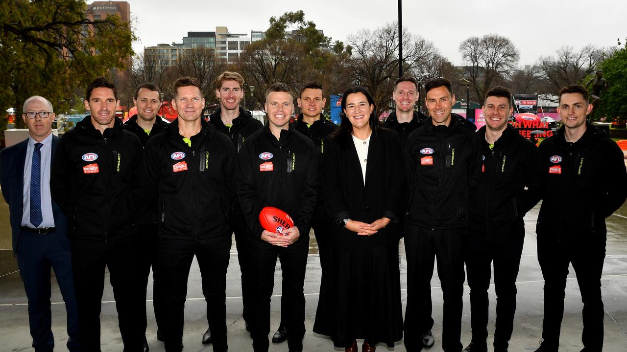 AFL football boss Laura Kane (centre right) with head of umpiring Stephen McBurney (left) and the 2024 grand final umpiring panel. Picture: Josh Chadwick / Getty Images