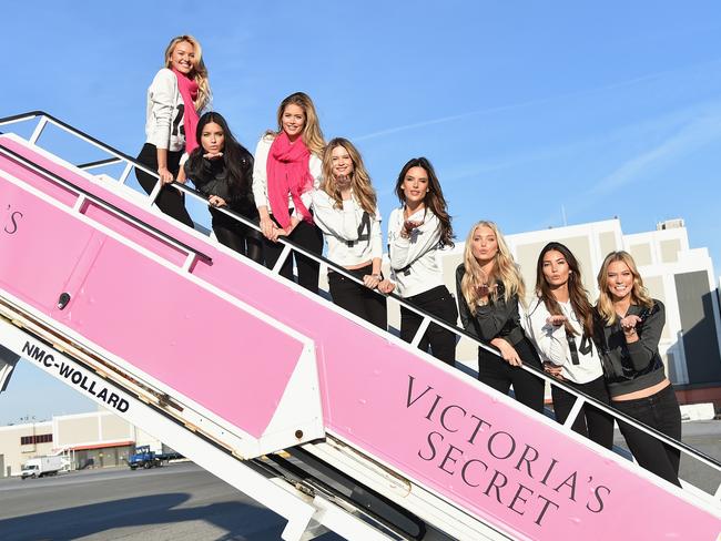 (L-R) Victoria's Secret Models Candice Swanepoel, Adriana Lima, Doutzen Kroes, Behati Prinsloo, Alessandra Ambrosio, Elsa Hosk, Lily Aldridge, and Karlie Kloss depart for London for the 2014 Victoria's Secret Fashion Show at JFK Airport.