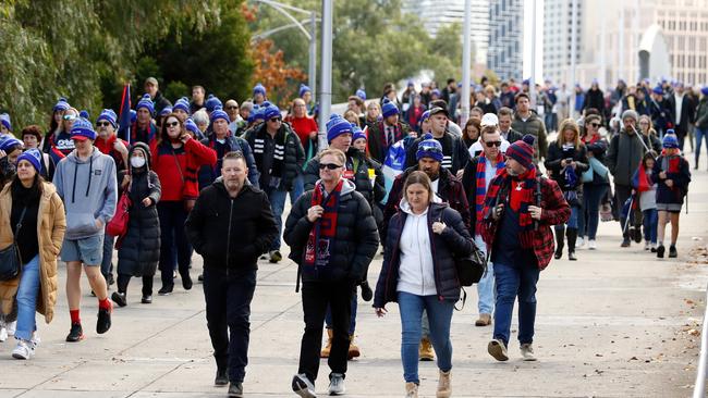 Fans arrive at the MCG for the Queen’s Birthday match. Picture: Getty Images