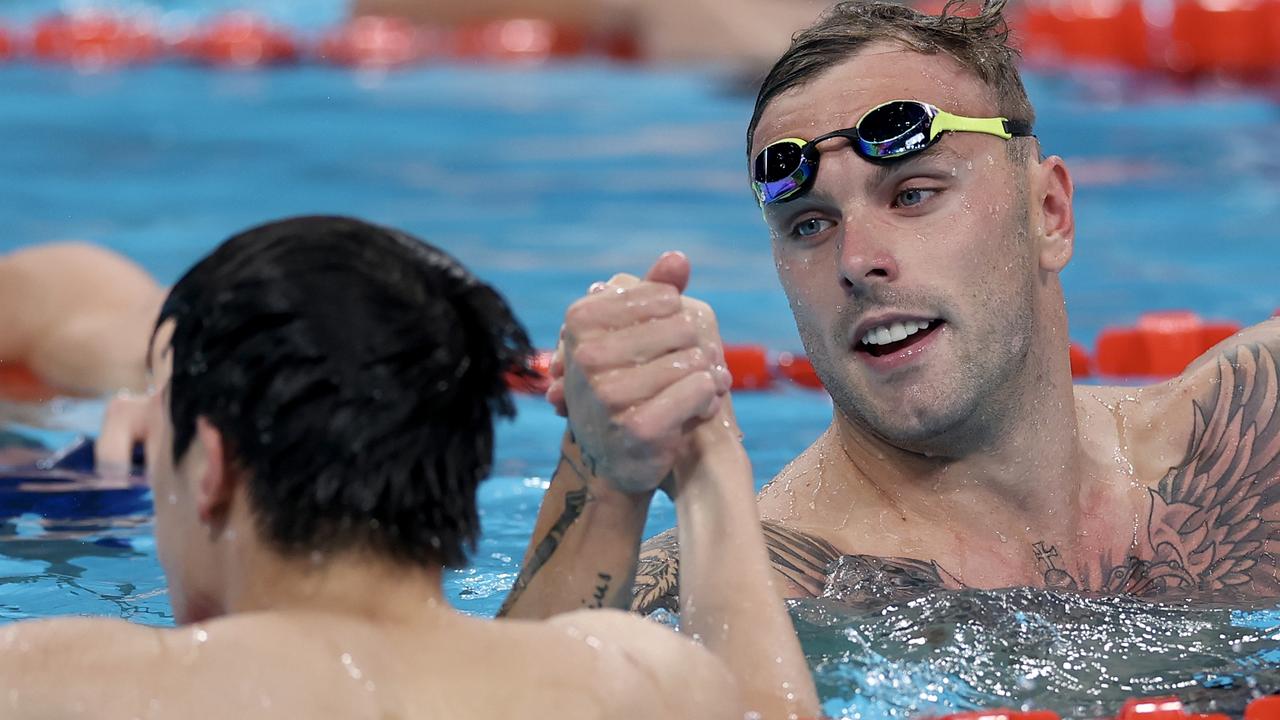 Silver medallist Kyle Chalmers congratulates race winner Zhanle Pan of China, who took the gold. Picture: Maddie Meyer/Getty Images