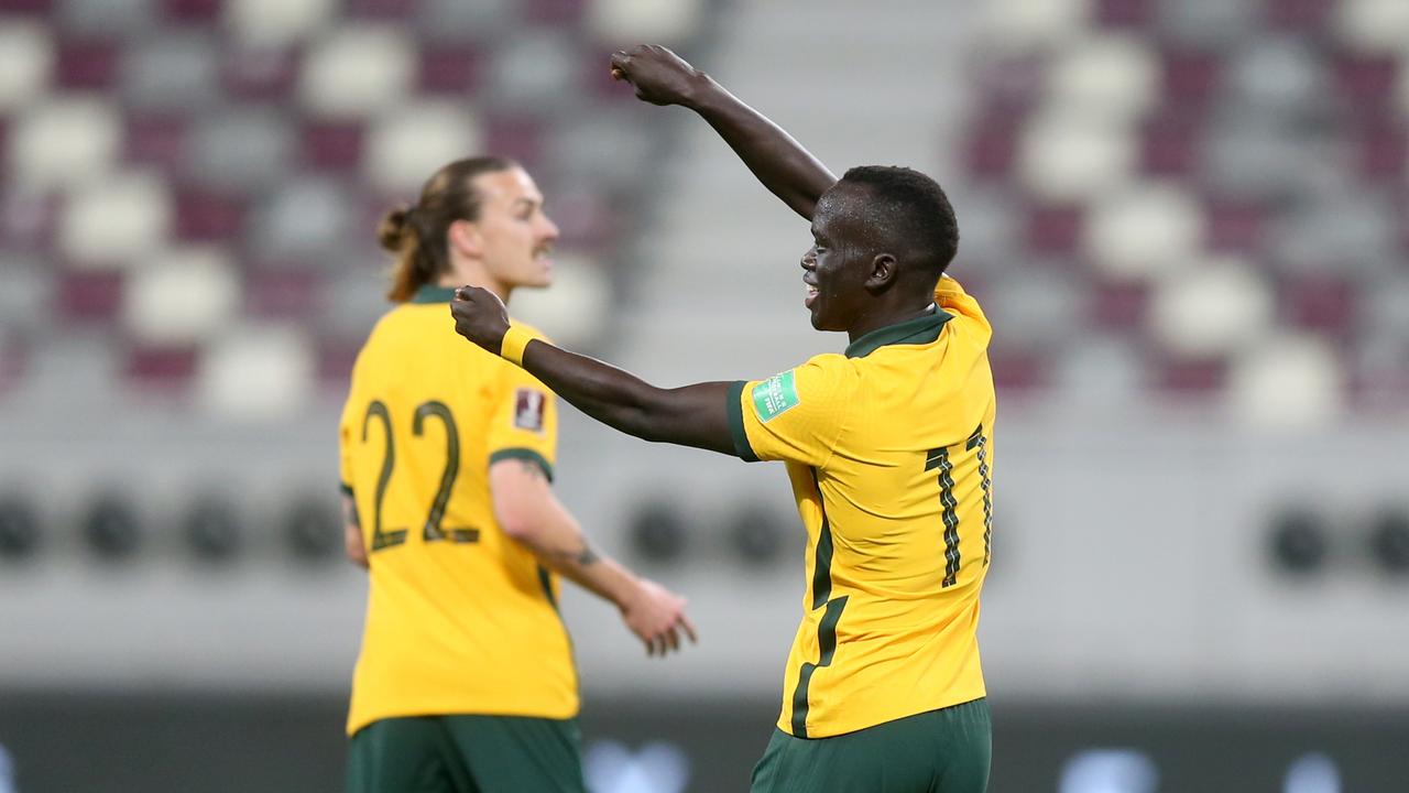 Awer Mabil celebrates after scoring the first goal in Australia’s 3-1 win over Oman. Picture: Mohamed Farag/Getty Images