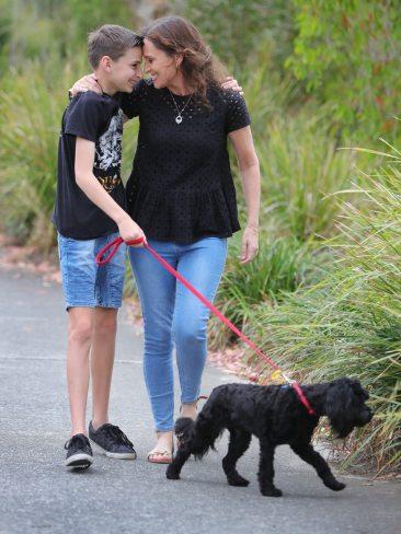 Oxenford single mum Lynne Stewart and son Alex with their dog Charley who have finally been reunited. Picture Glenn Hampson