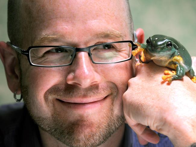 University of Adelaide ecologist associate professor Corey Bradshaw pictured with Emily the Splendid Tree Frog at the Adelaide Zoo.