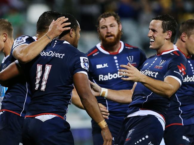 CANBERRA, AUSTRALIA - APRIL 18: Sefanaia Naivalu of the Rebels is congratulated after scoring a try during the round 10 Super Rugby match between the Brumbies and the Rebels at GIO Stadium on April 18, 2015 in Canberra, Australia. (Photo by Stefan Postles/Getty Images)